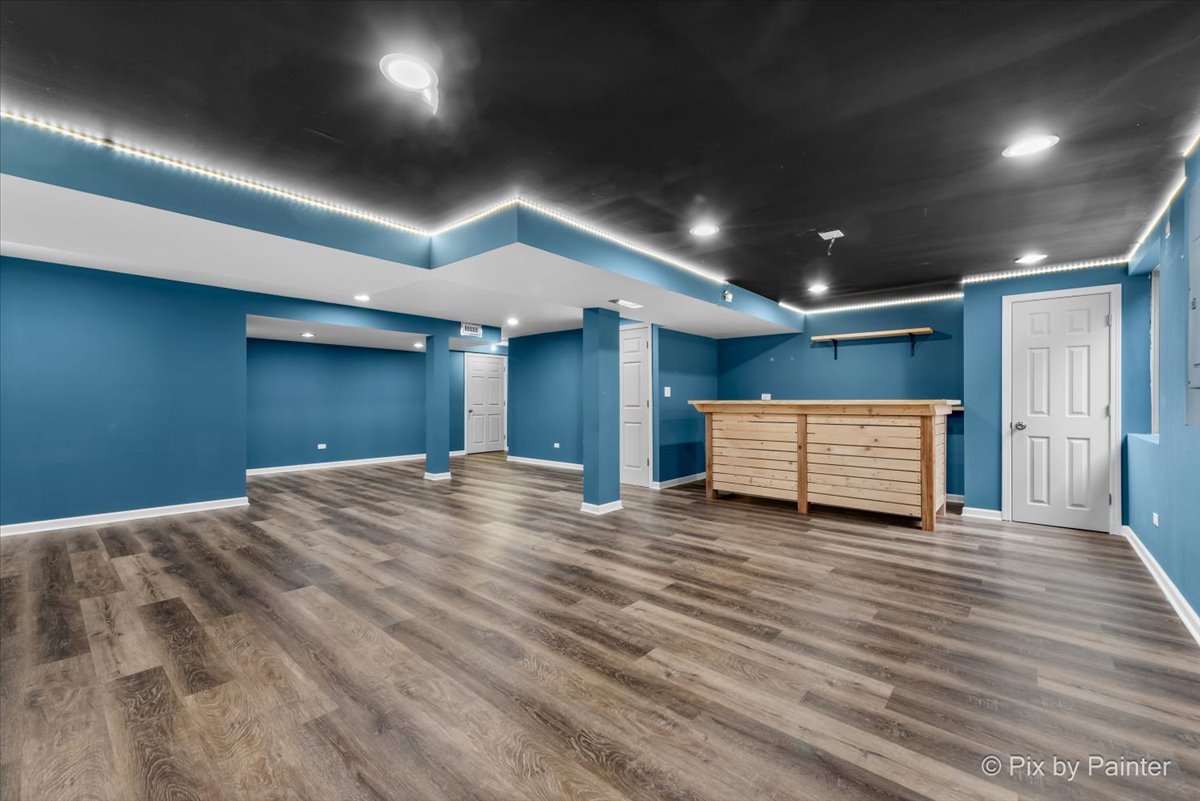 486 Vaughn Circle Aurora, IL 60502 - Photo 26 of 40 a view of empty room with wooden floor