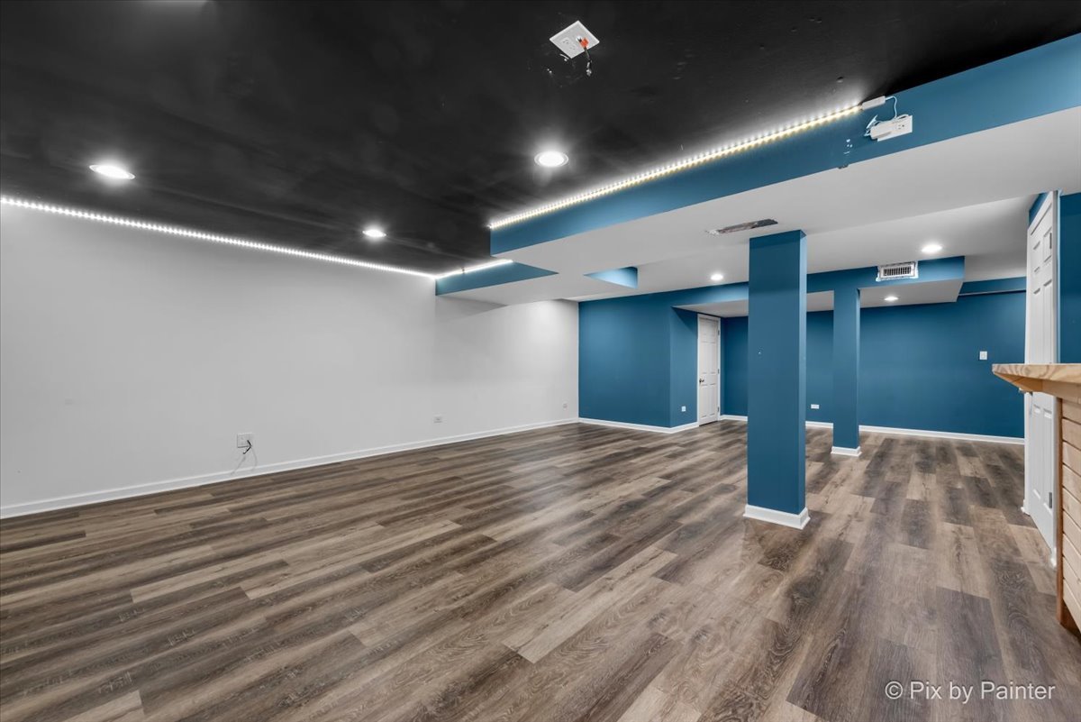 486 Vaughn Circle Aurora, IL 60502 - Photo 28 of 40 a view of empty room with wooden floor