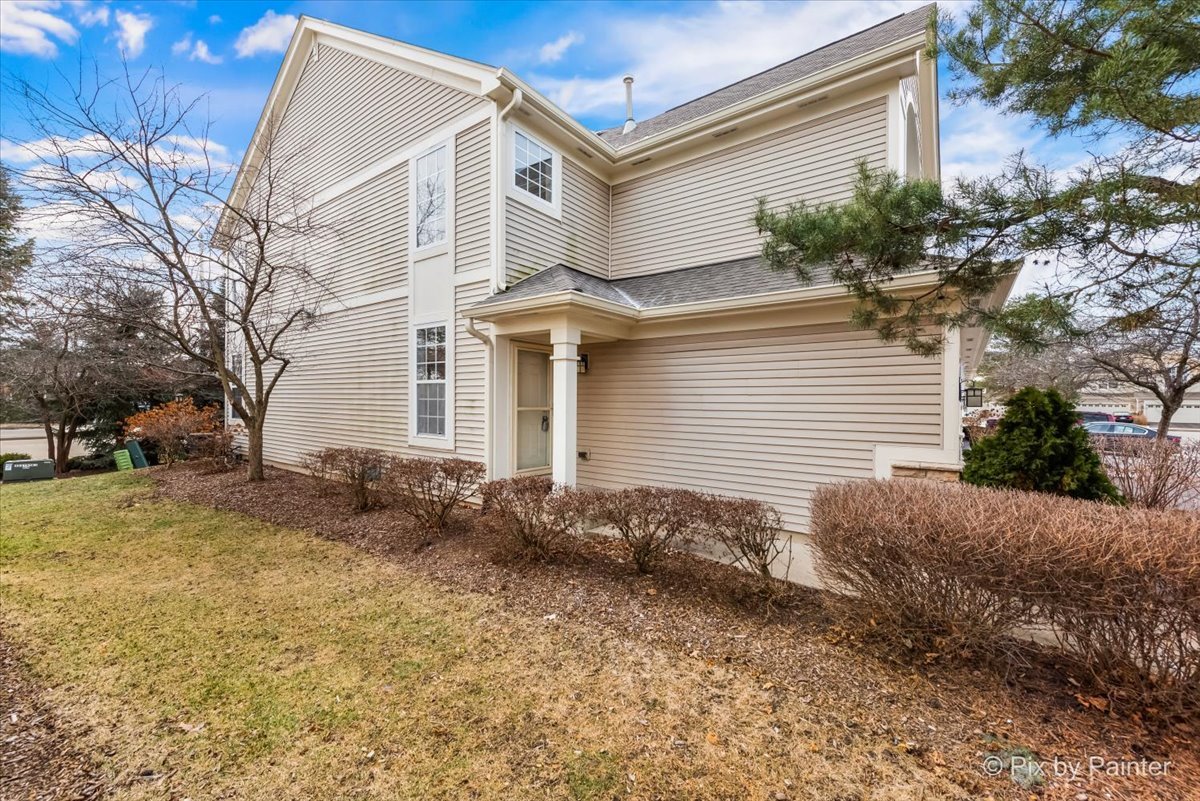 486 Vaughn Circle Aurora, IL 60502 - Photo 32 of 40 a view of a house with a yard