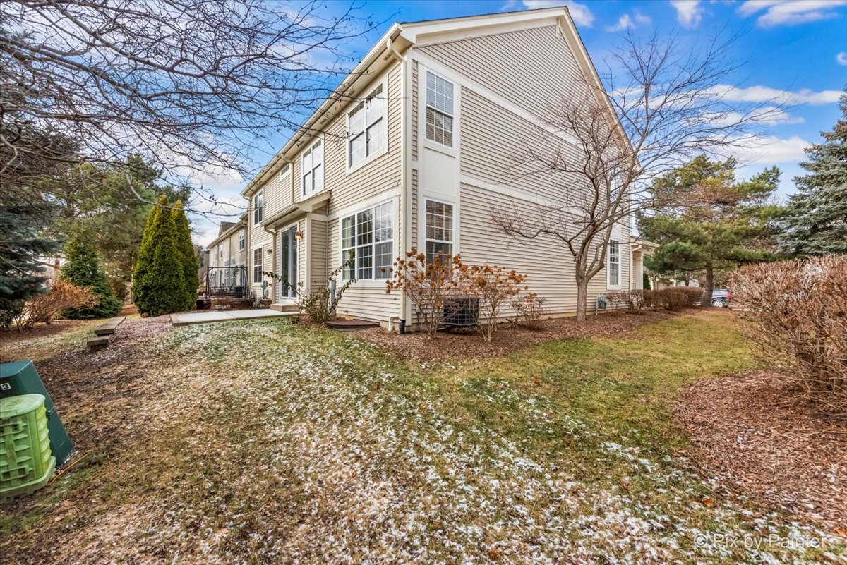 486 Vaughn Circle Aurora, IL 60502 - Photo 34 of 40 a view of a house with a yard
