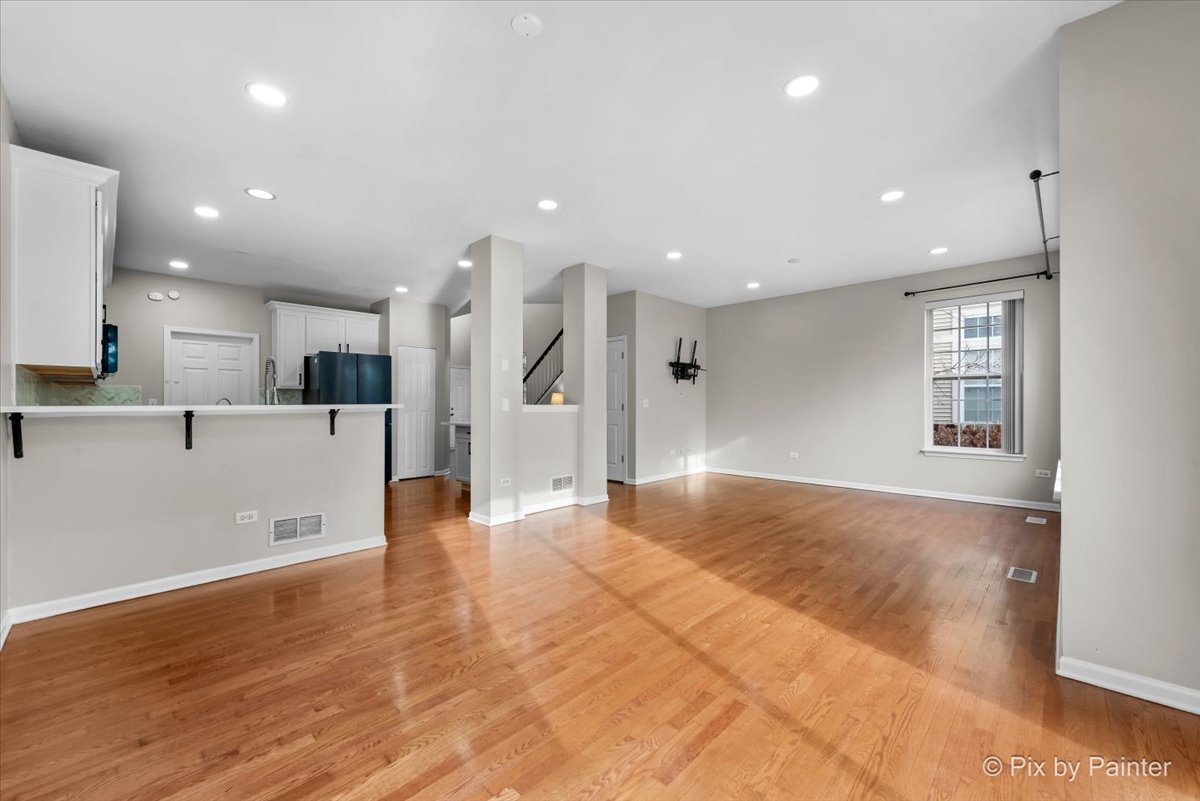 486 Vaughn Circle Aurora, IL 60502 - Photo 6 of 40 a view of a kitchen with stainless steel appliances a refrigerator and a window