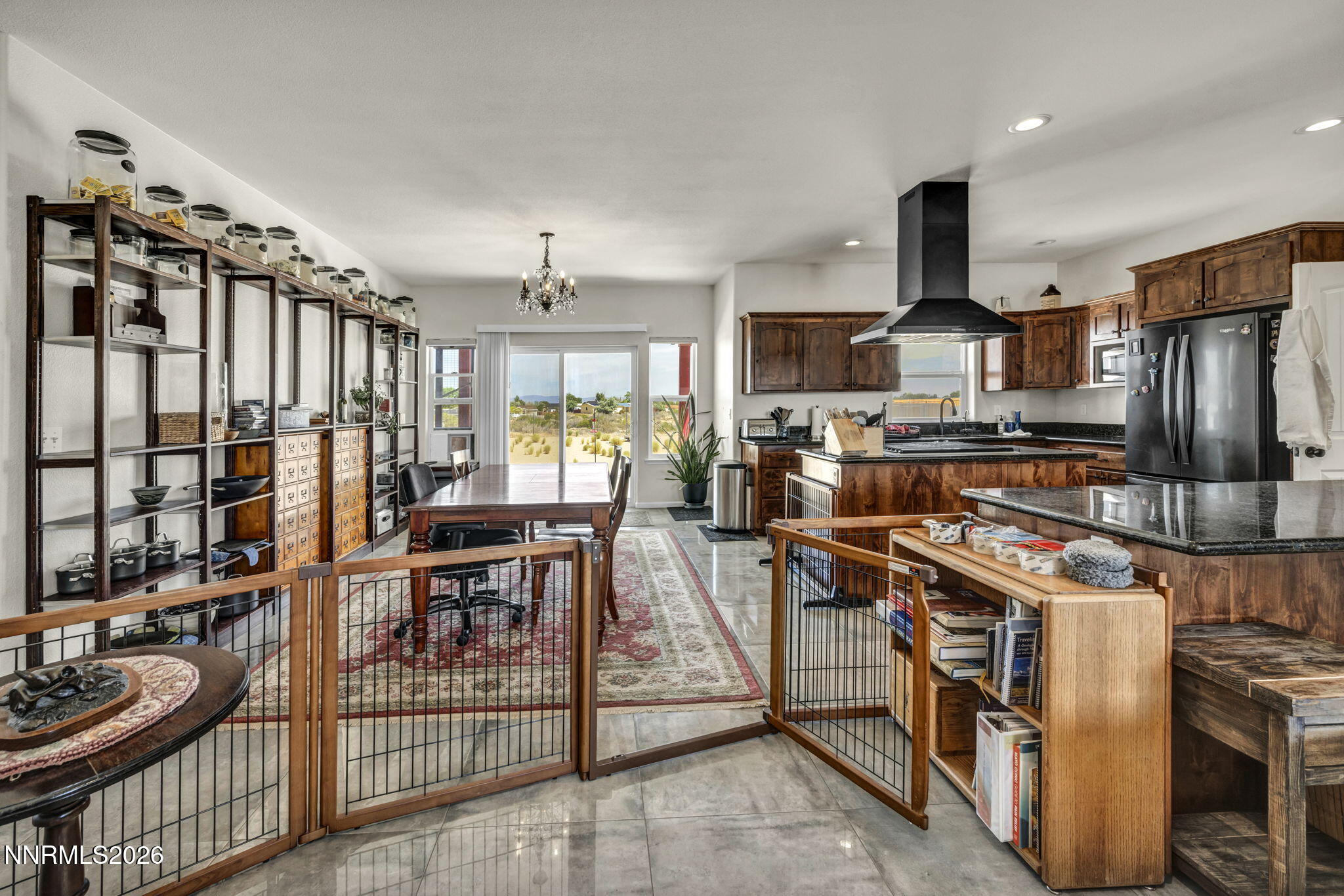 1286 Sky Ridge Drive Fallon, NV 89406 - Photo 13 of 49 a kitchen with stainless steel appliances granite countertop a stove refrigerator and chairs