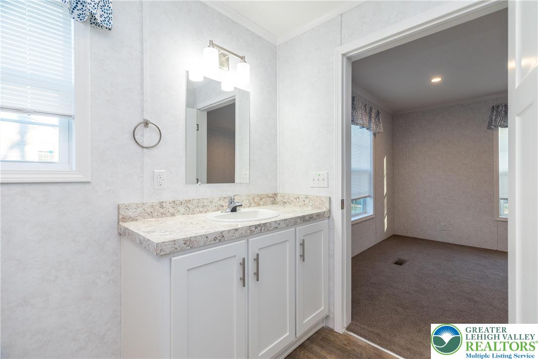 465 Royal Manor Road, Unit LOT 8 Easton, PA 18042 - Photo 12 of 23 a bathroom with a sink a toilet and mirror