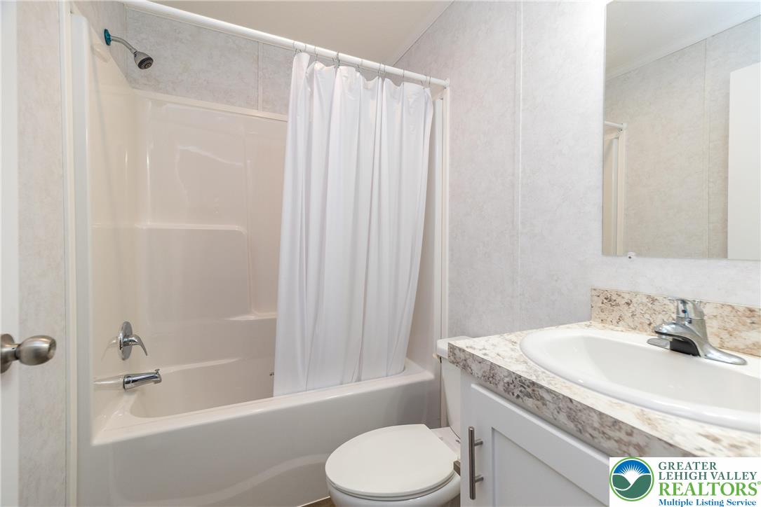 465 Royal Manor Road, Unit LOT 8 Easton, PA 18042 - Photo 13 of 23 a bathroom with a granite countertop sink toilet and shower