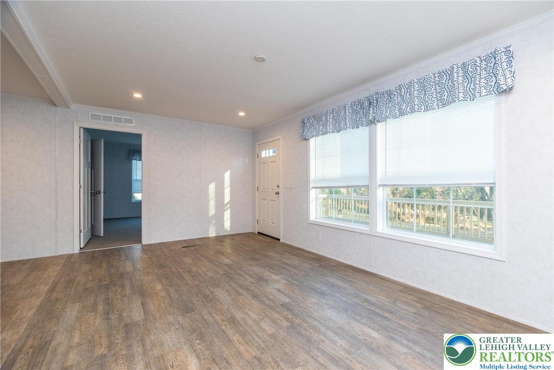 465 Royal Manor Road, Unit LOT 8 Easton, PA 18042 - Photo 7 of 23 a view of an empty room with a window and wooden floor