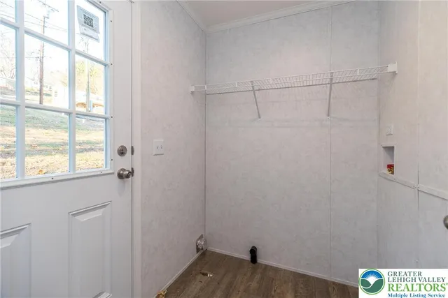 a view of small space with empty racks on the wall