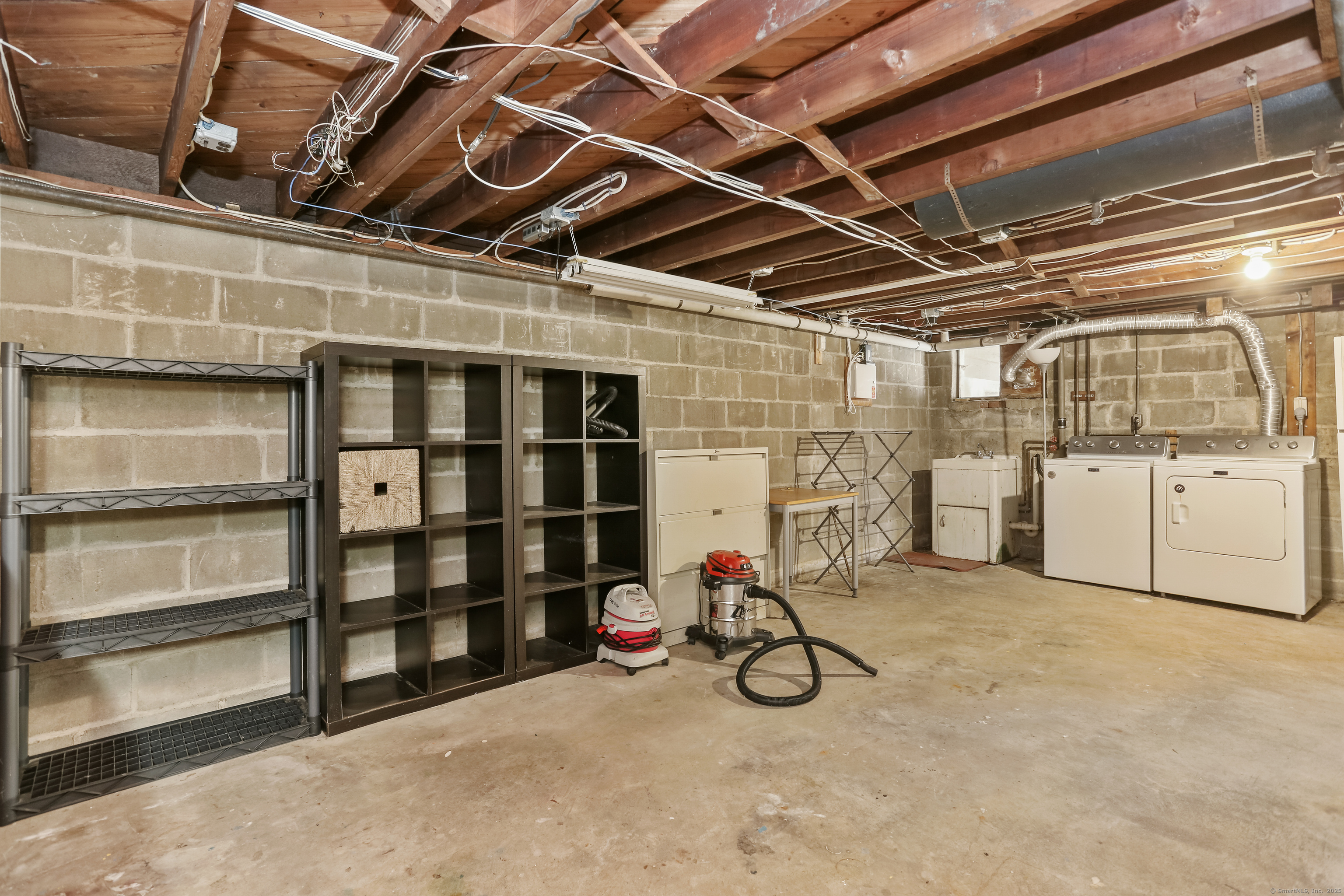 219 Hollow Tree Ridge Road Darien, CT 06820 - Photo 21 of 27 Large dry basement with storage
