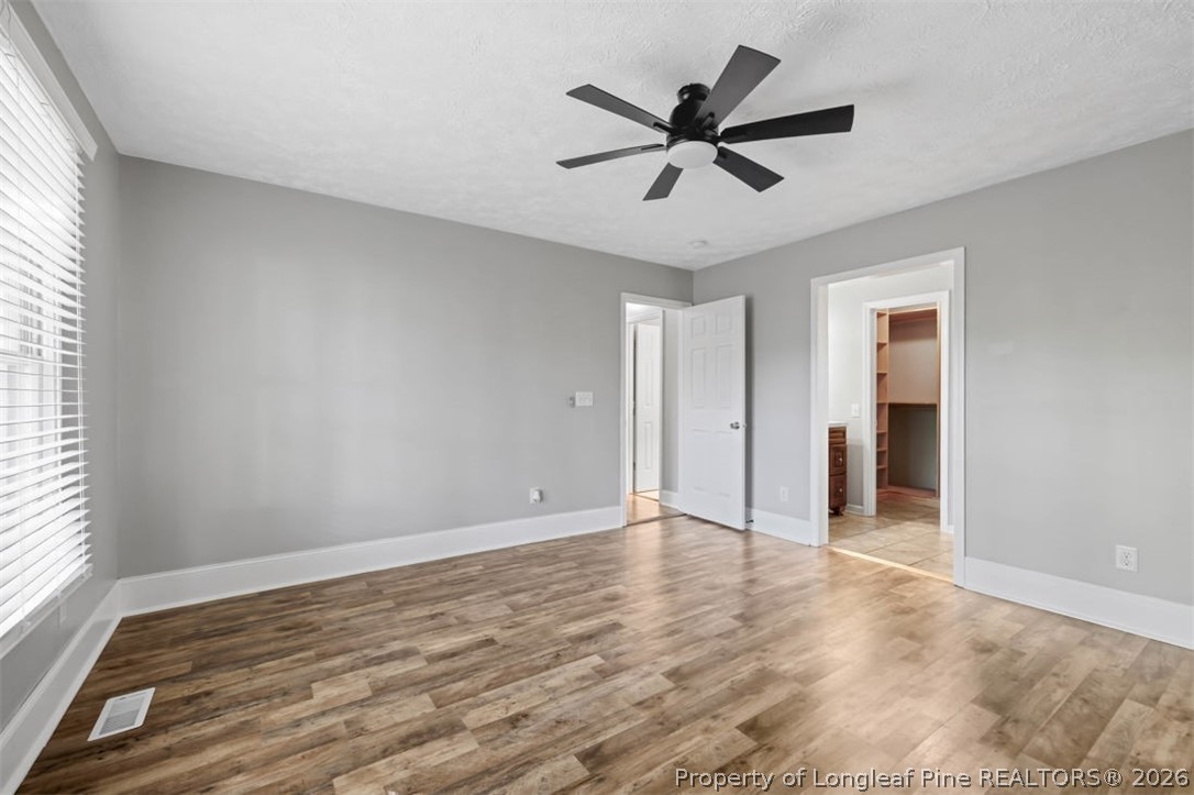 1205 Crossbend Court Fayetteville, NC 28314 - Photo 21 of 37 an empty room with wooden floor and windows