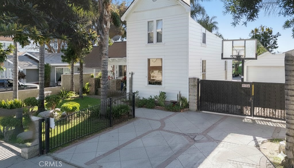 8110 3rd Street Downey, CA 90241 - Photo 2 of 7 a view of a patio with table and chairs potted plants