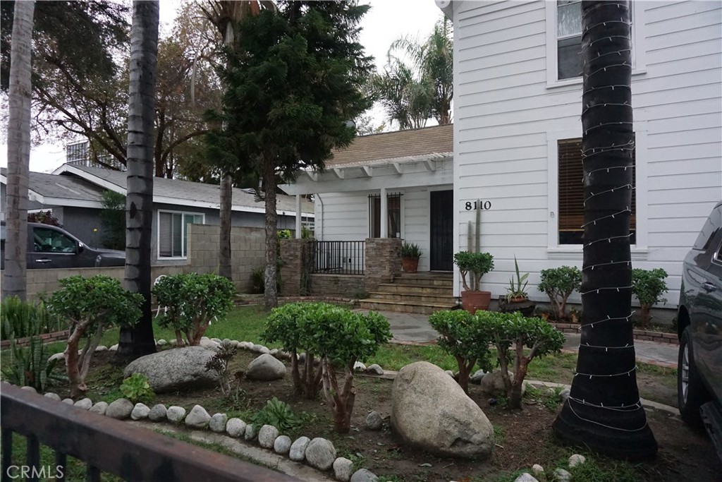 8110 3rd Street Downey, CA 90241 - Photo 7 of 7 a front view of a house with garden