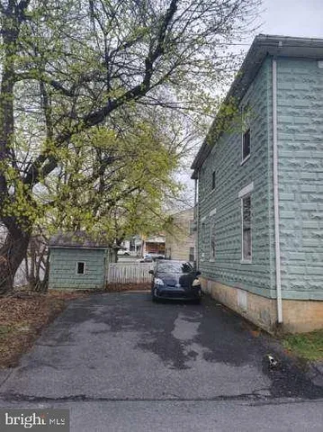 a view of a house with a back yard