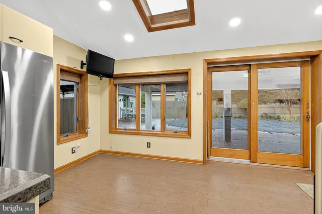 a living room with furniture rug and a table