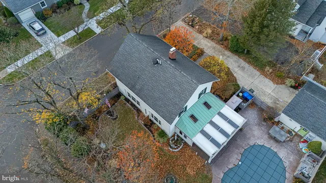 a view of a house with backyard porch and sitting area
