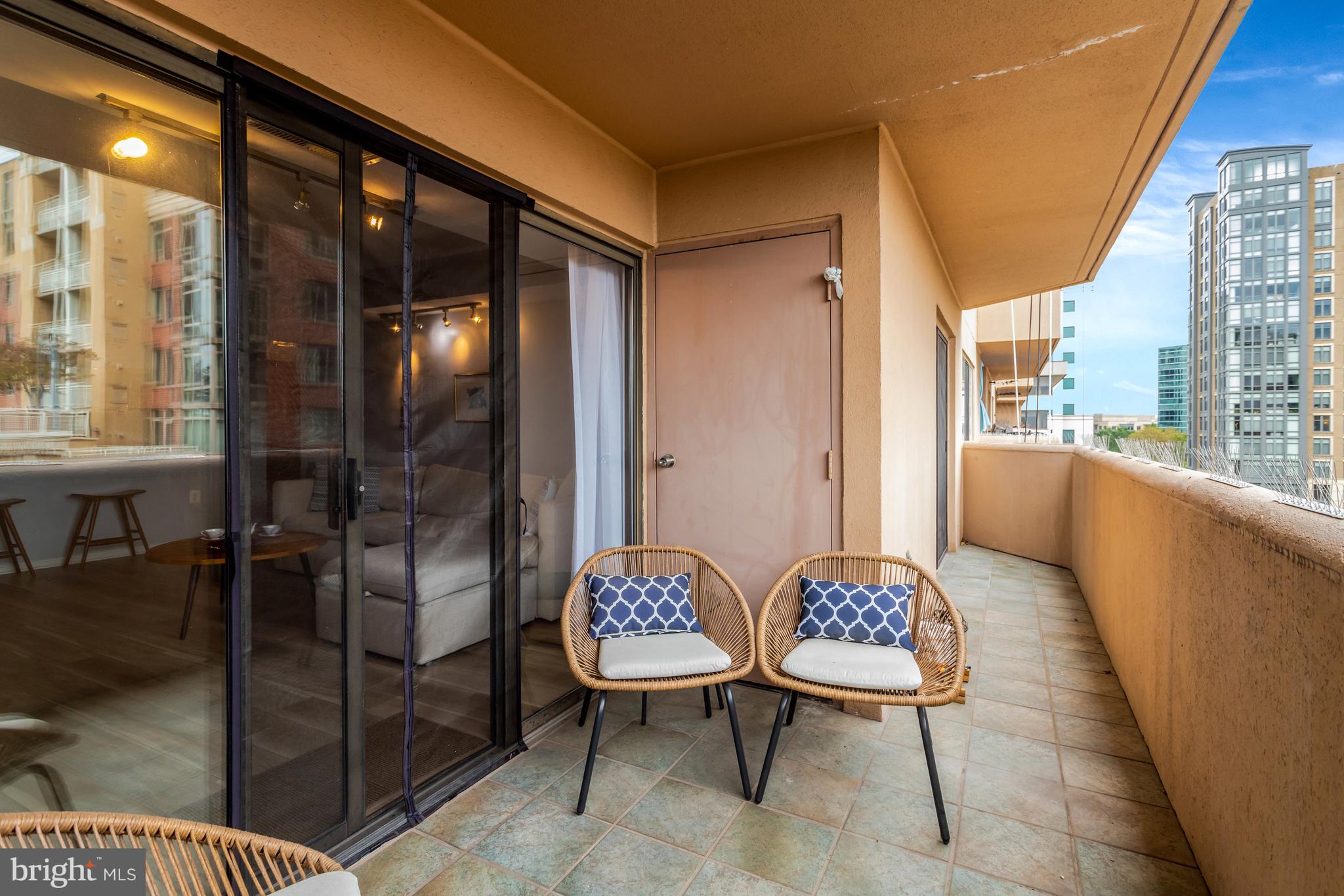 1301 North Courthouse Road, Unit 1108 Arlington, VA 22201 - Photo 13 of 49 a balcony with furniture and a large window