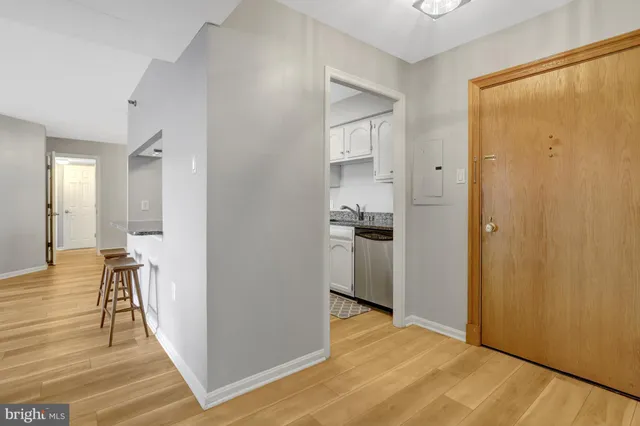 a spacious bedroom with a bed and a table in it