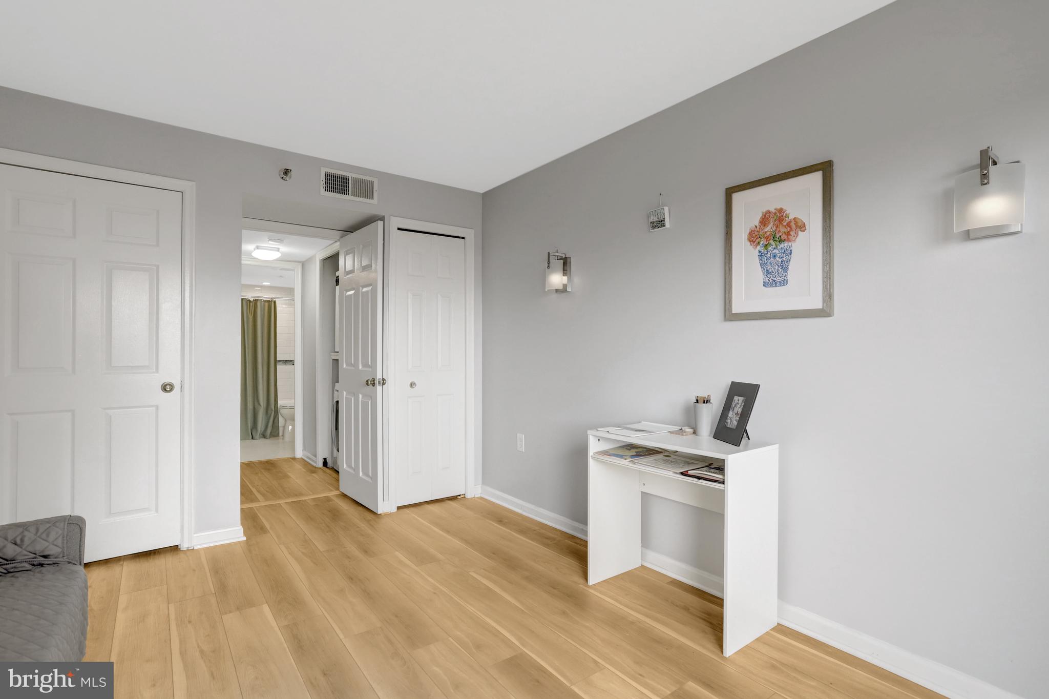 1301 North Courthouse Road, Unit 1108 Arlington, VA 22201 - Photo 26 of 49 a view of a kitchen with a sink a refrigerator and wooden floor