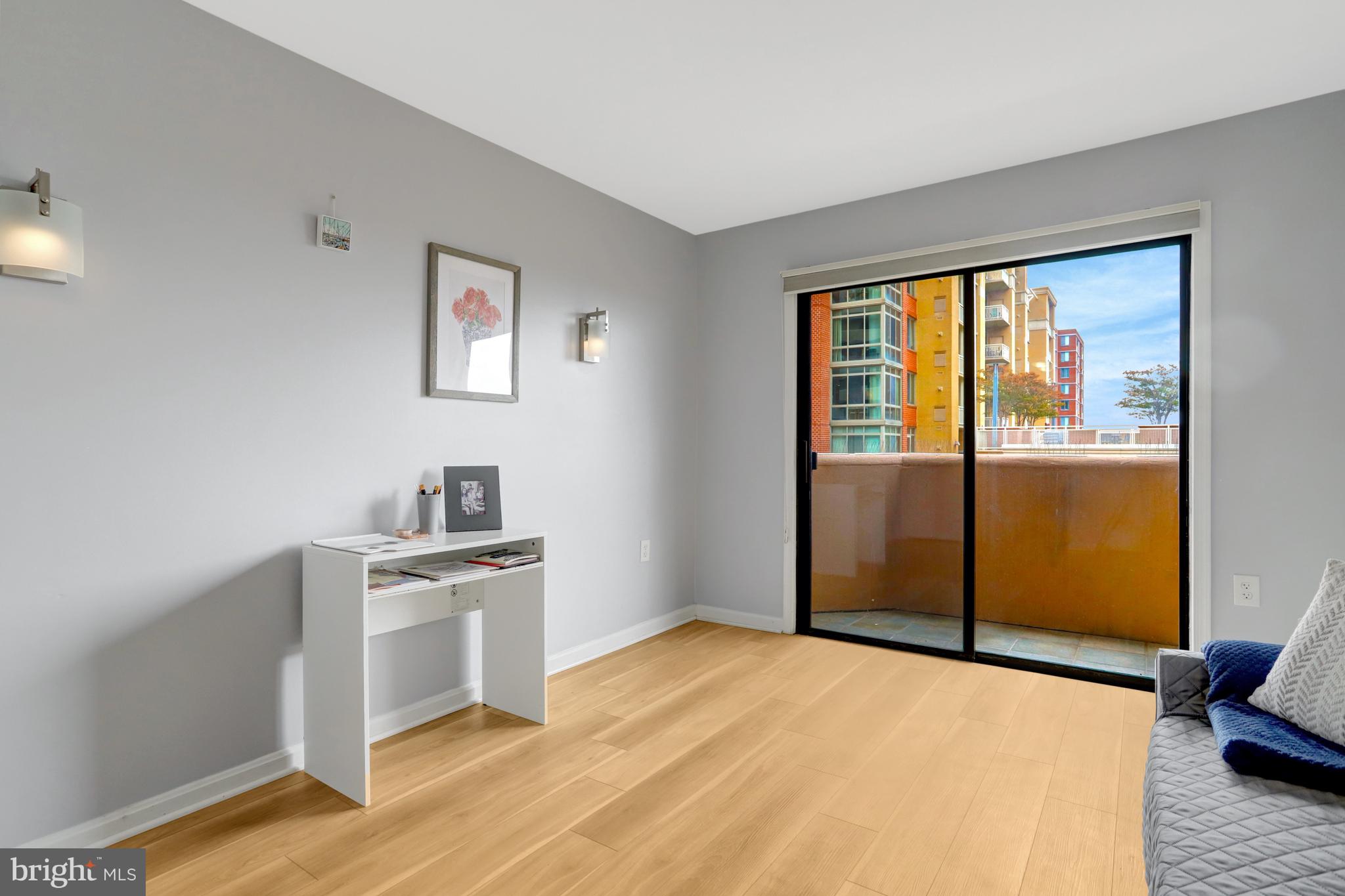 1301 North Courthouse Road, Unit 1108 Arlington, VA 22201 - Photo 29 of 49 a view of a kitchen with wooden floor and electronic appliances