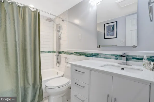 a view of a kitchen with wooden floor and electronic appliances