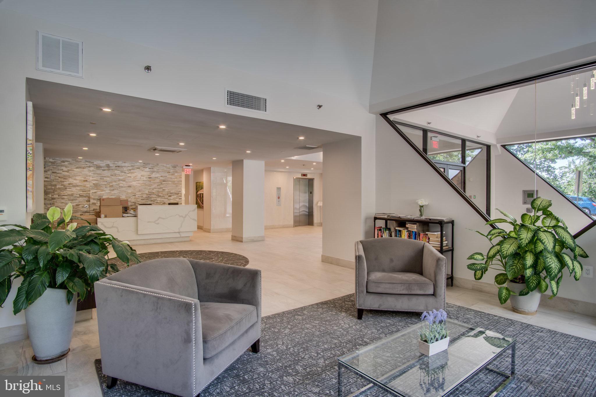 1301 North Courthouse Road, Unit 1108 Arlington, VA 22201 - Photo 36 of 49 a living room with furniture and a potted plant