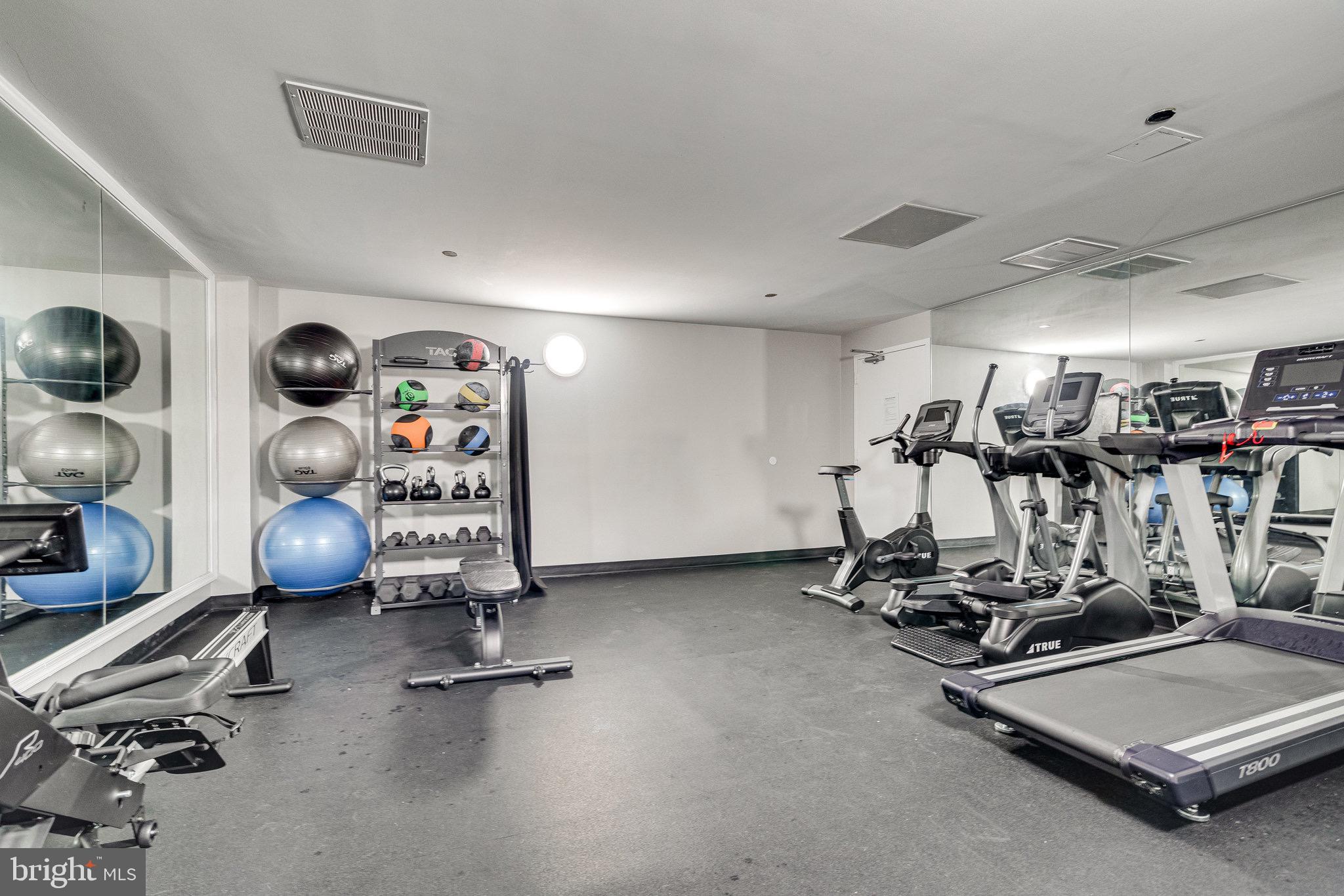 1301 North Courthouse Road, Unit 1108 Arlington, VA 22201 - Photo 40 of 49 a room with gym equipment