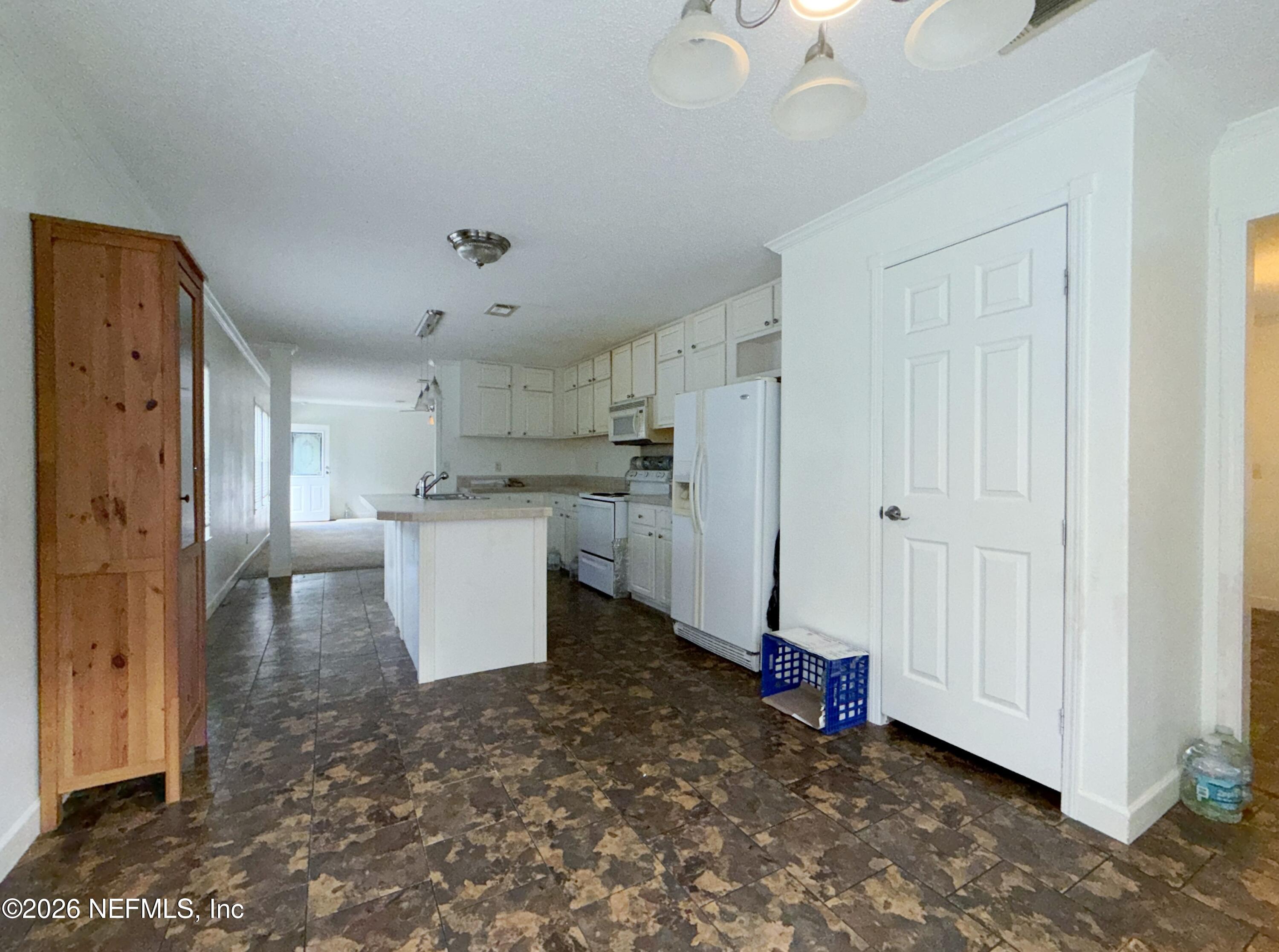 136 Short Pine Road Hawthorne, FL 32640 - Photo 15 of 39 a view of a kitchen with refrigerator and a sink