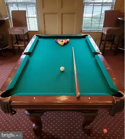 a view of a room with furniture and a window