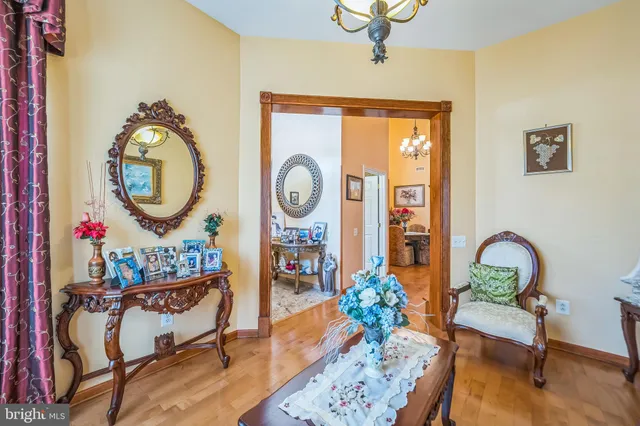 a living room with furniture and a clock