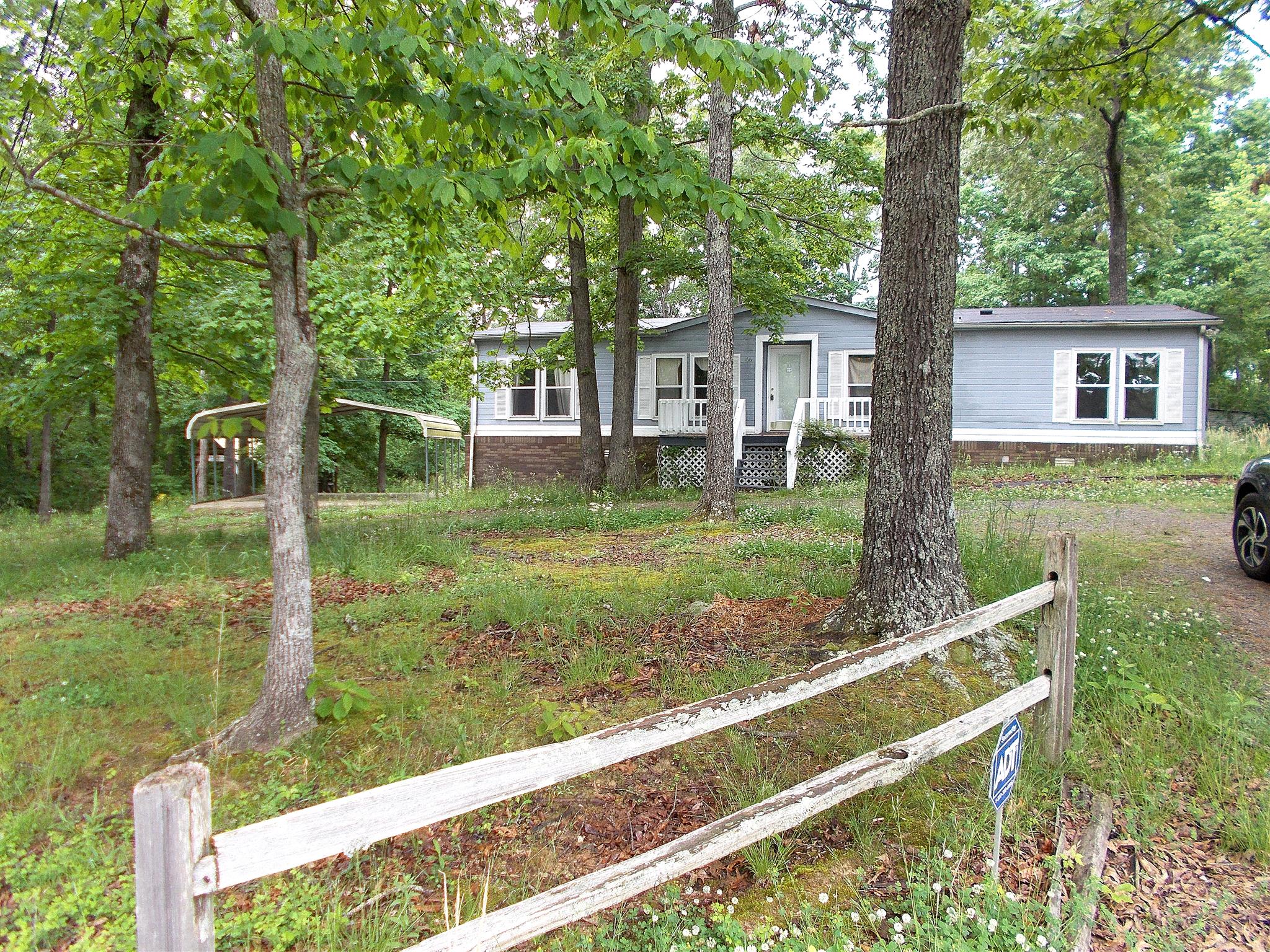 166 Duke Road Dickson, TN 37055 - Photo 1 of 25 a view of a house with a yard from a tree
