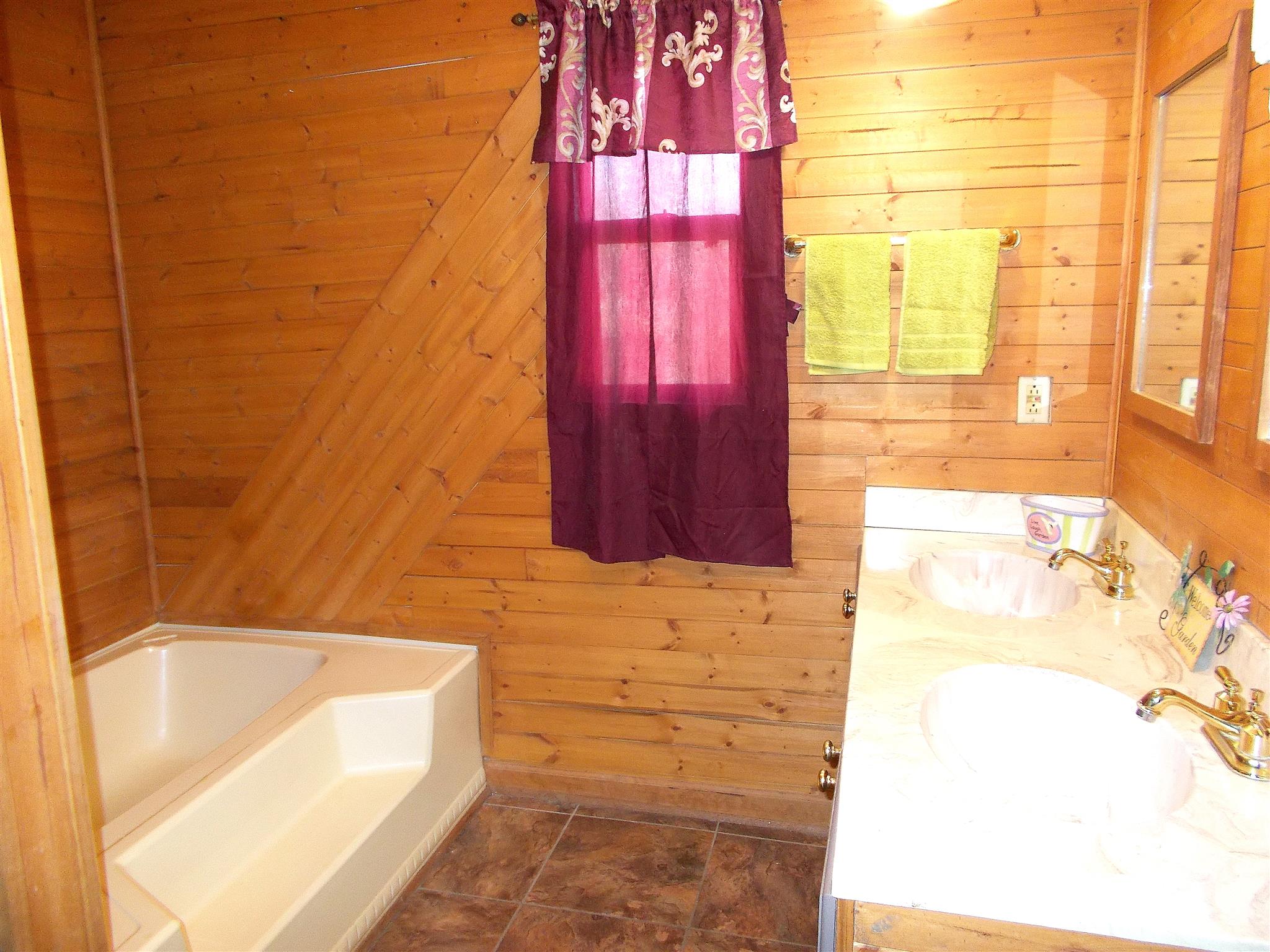166 Duke Road Dickson, TN 37055 - Photo 17 of 25 a bathroom with a bathtub and shower