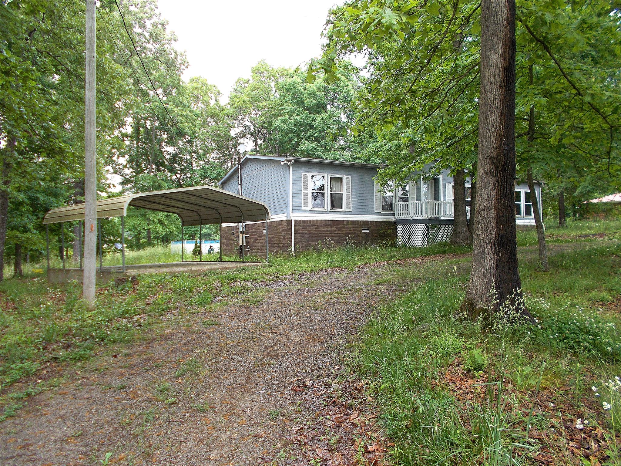166 Duke Road Dickson, TN 37055 - Photo 2 of 25 a backyard of a house with seating space