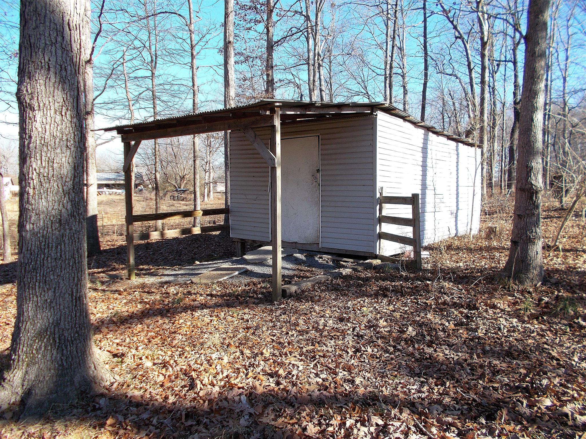166 Duke Road Dickson, TN 37055 - Photo 23 of 25 a backyard of a house with large trees