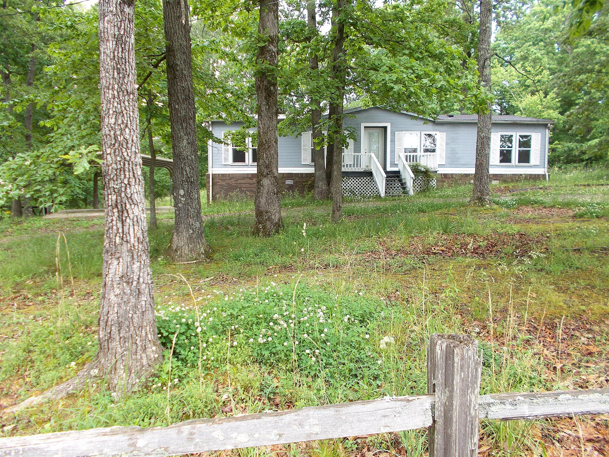 166 Duke Road Dickson, TN 37055 - Photo 3 of 25 a backyard of a house with lots of green space