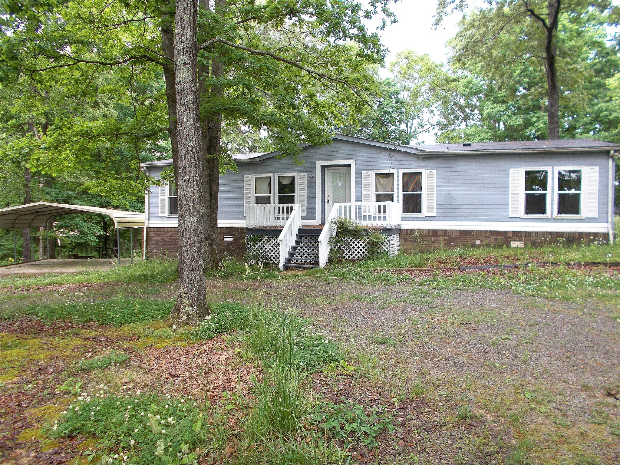 166 Duke Road Dickson, TN 37055 - Photo 4 of 25 a backyard of a house with seating space