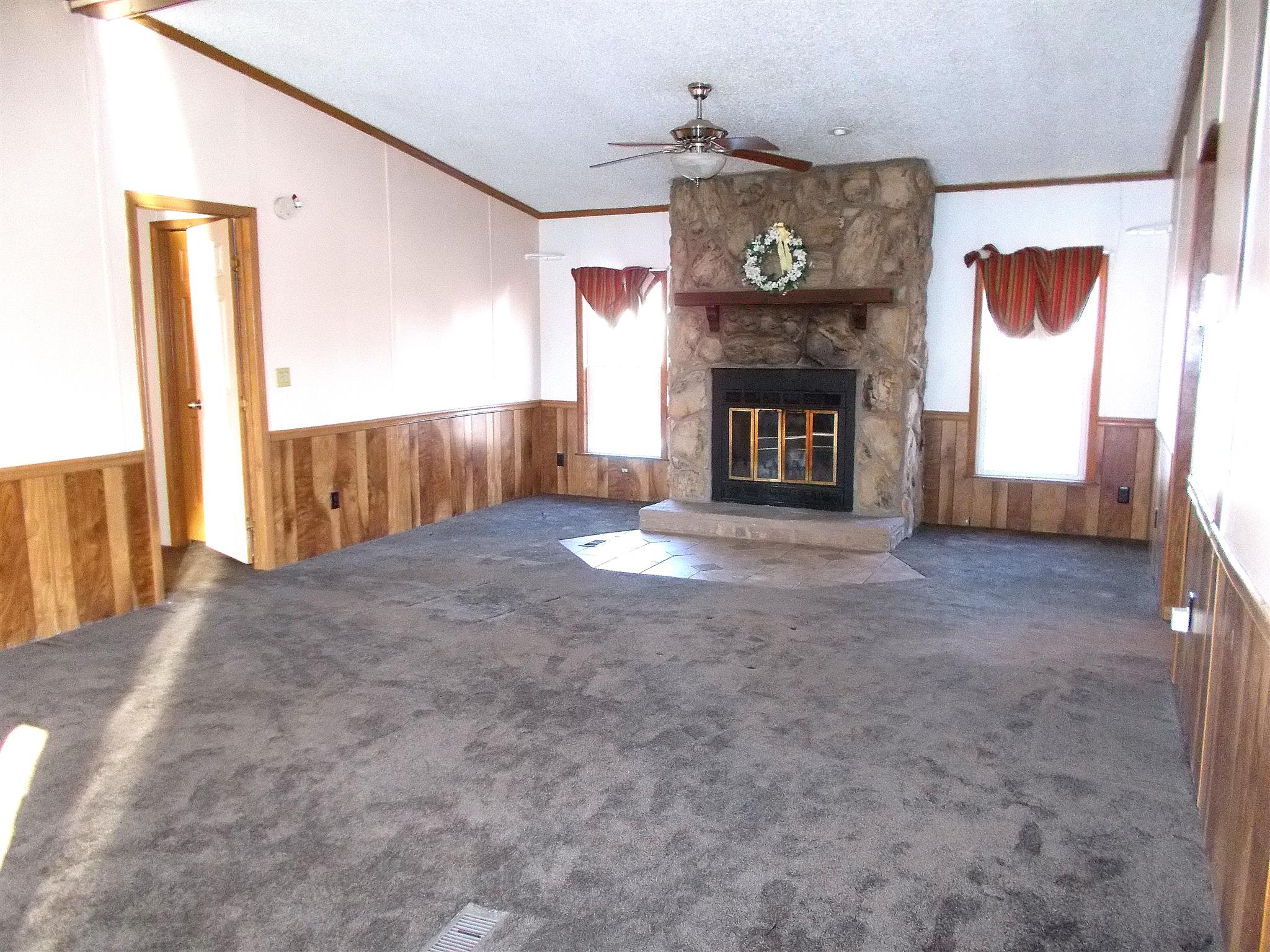 166 Duke Road Dickson, TN 37055 - Photo 7 of 25 a view of an empty room with a fireplace
