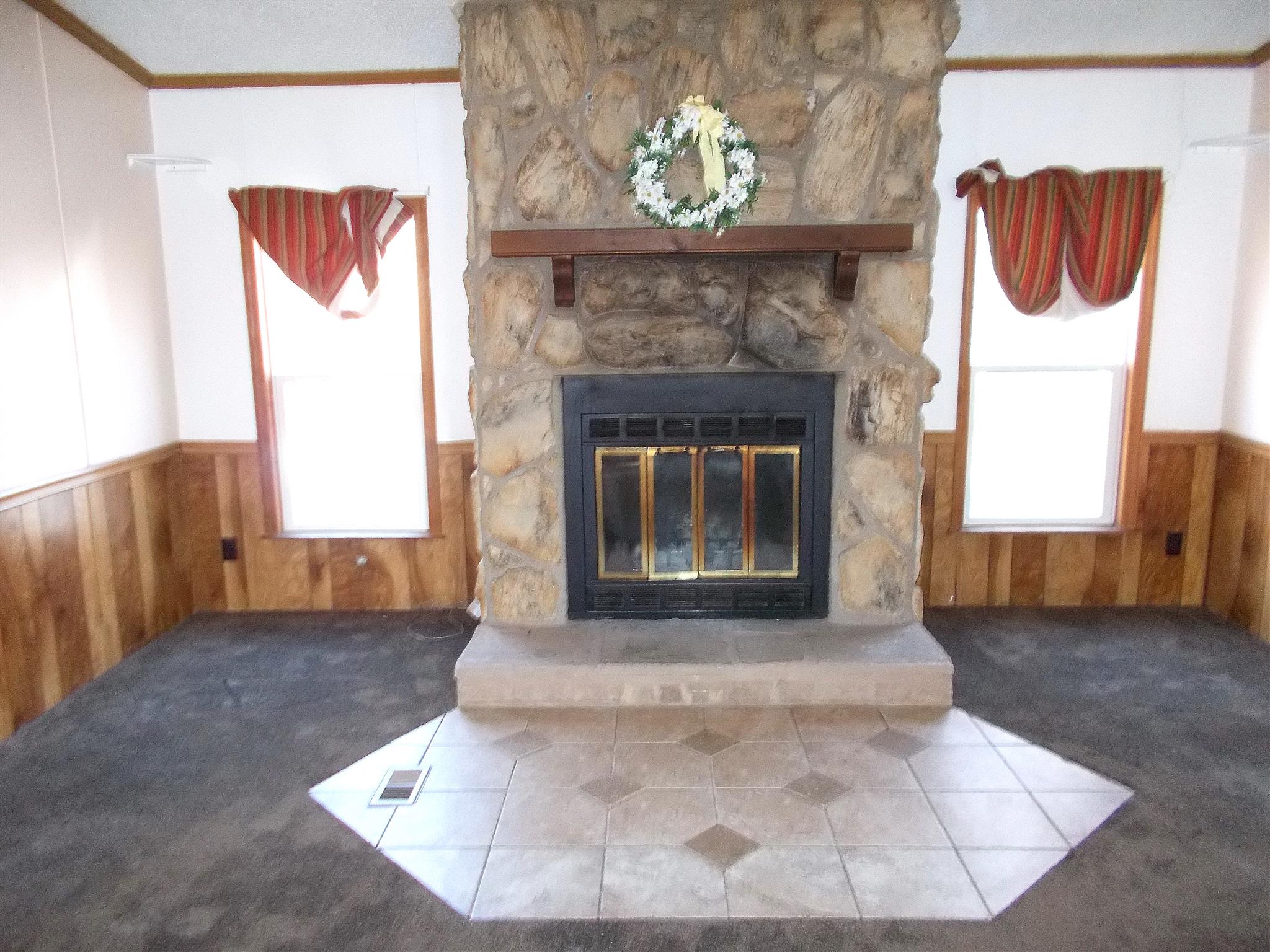166 Duke Road Dickson, TN 37055 - Photo 8 of 25 a view of a livingroom with a fireplace and window