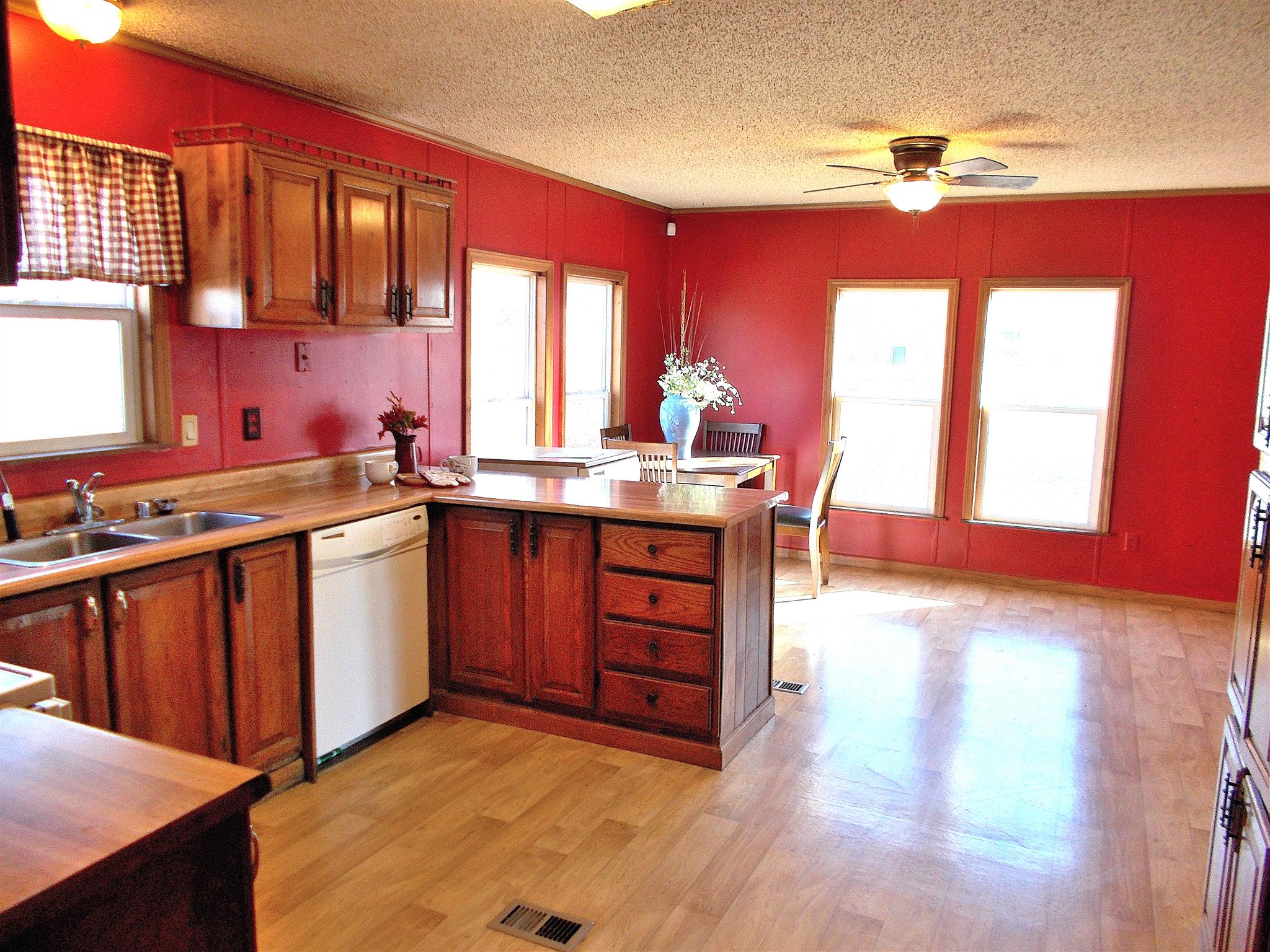 166 Duke Road Dickson, TN 37055 - Photo 10 of 25 a kitchen with a sink stove and cabinets