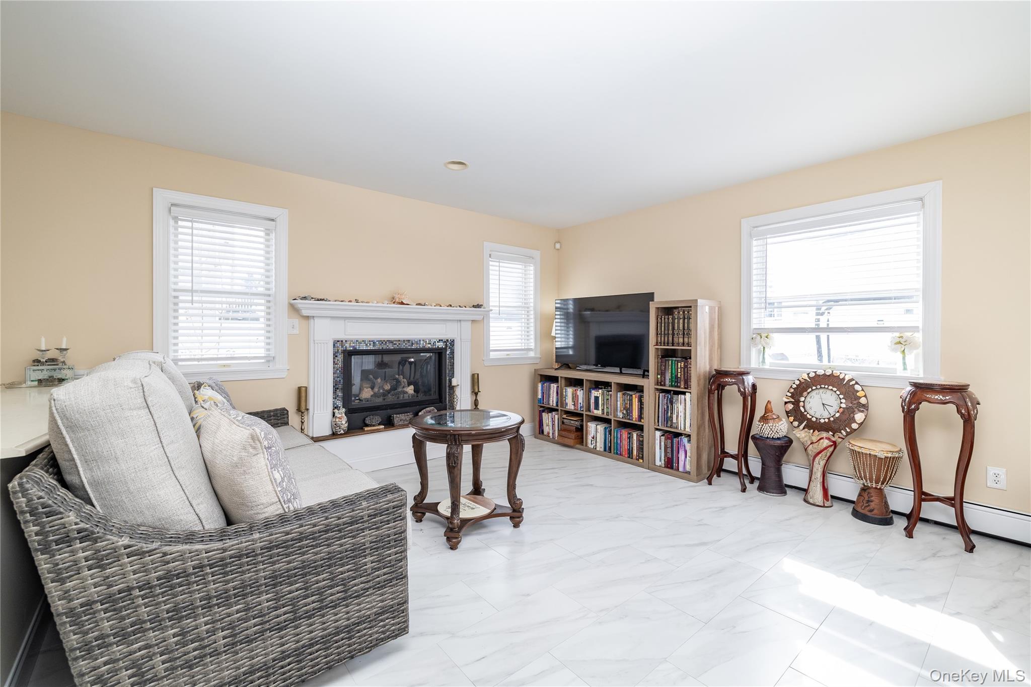 458 East Pine Street Long Beach, NY 11561 - Photo 12 of 26 a living room with furniture and a flat screen tv