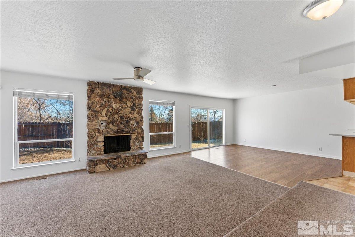 550 Ferol Way Reno, NV 89503 - Photo 5 of 34 an empty room with windows and fireplace