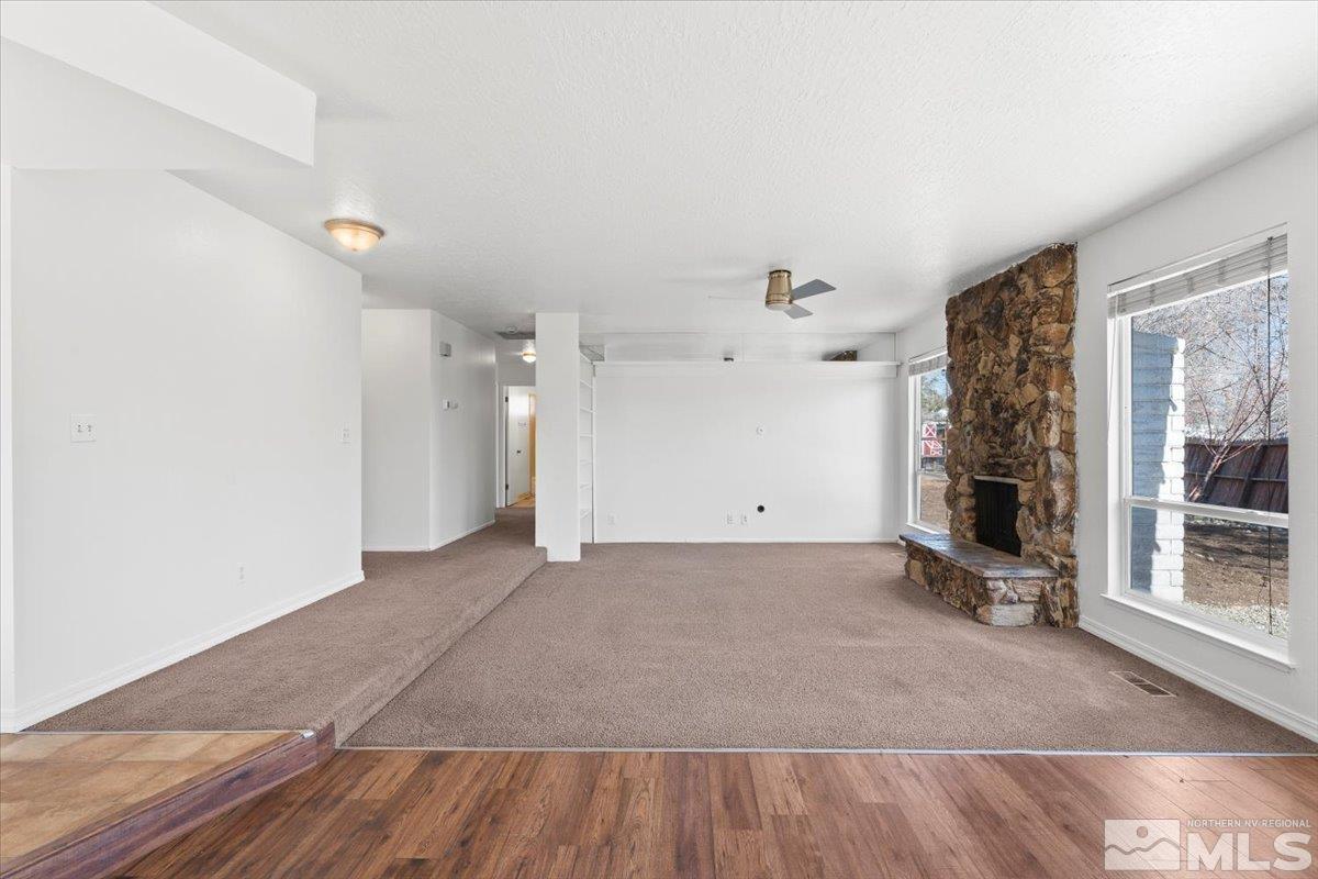 550 Ferol Way Reno, NV 89503 - Photo 8 of 34 a view of empty room with wooden floor and fan