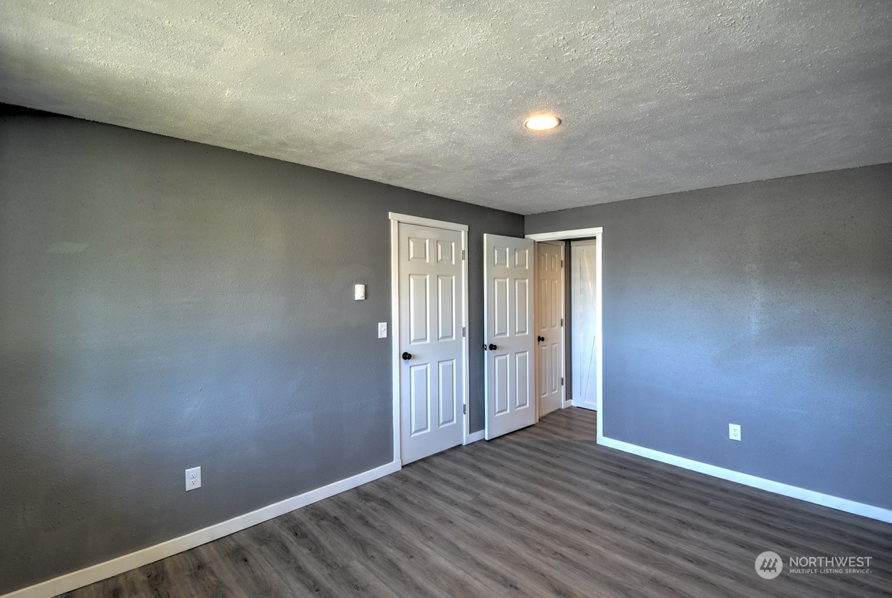 3583 East R Street Tacoma, WA 98404 - Photo 11 of 29 a view of an empty room with wooden floor