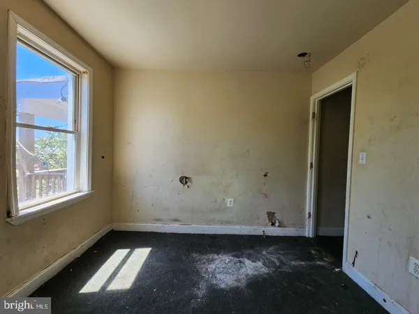 a view of an empty room and window