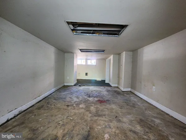 a view of a back yard with yellow house