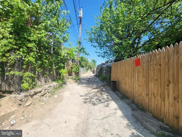 a view of a backyard with a small deck