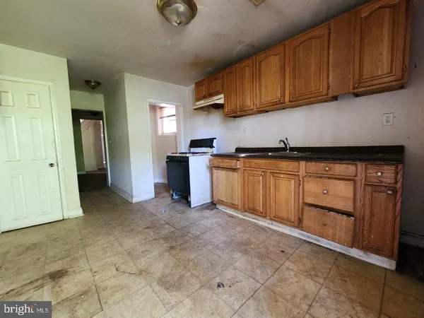 a view of a kitchen with electric appliances