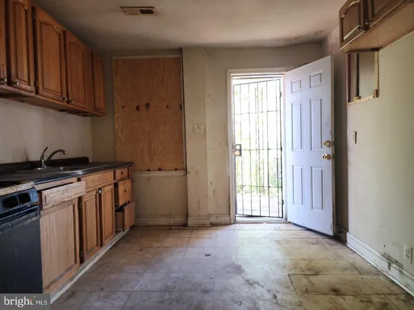 a view of a kitchen with electric appliances