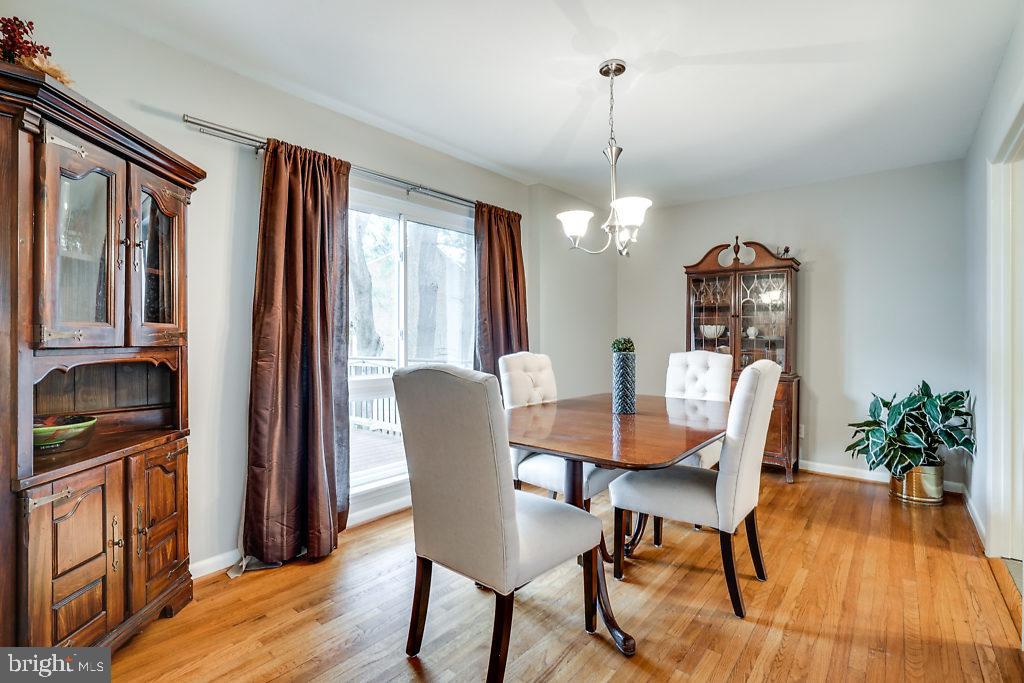 11041 Saffold Way Reston, VA 20190 - Photo 14 of 44 a view of a dining room with furniture window and wooden floor