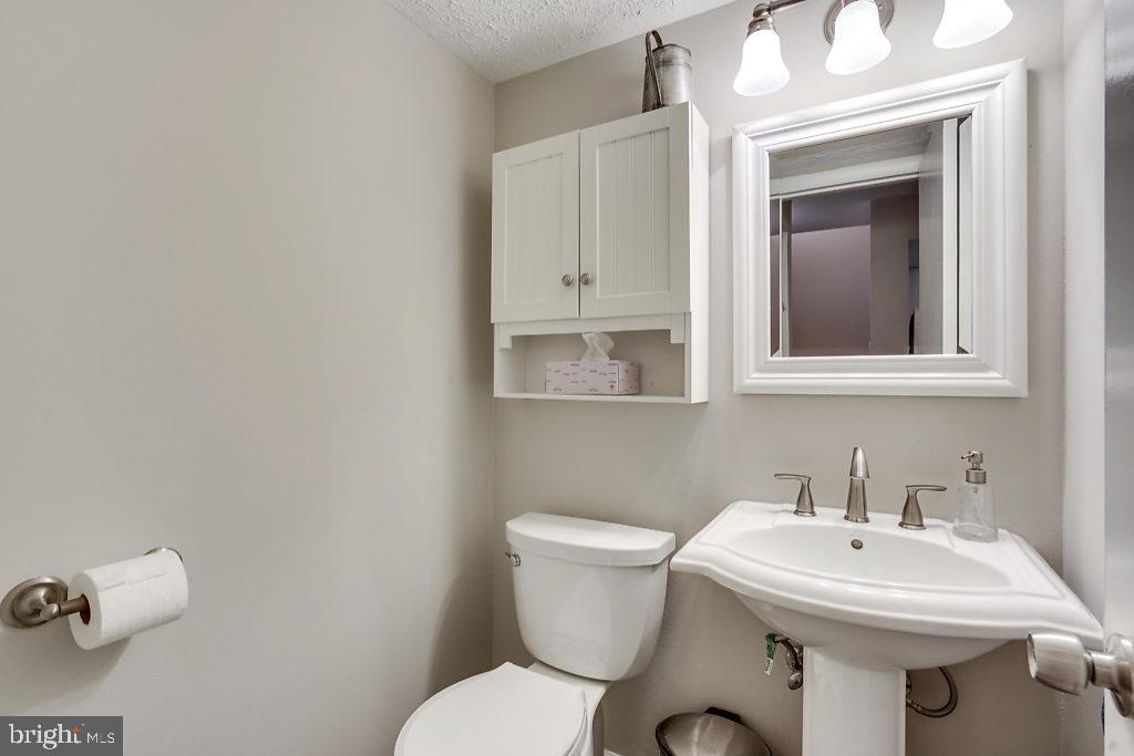 11041 Saffold Way Reston, VA 20190 - Photo 15 of 44 a bathroom with a sink and a toilet