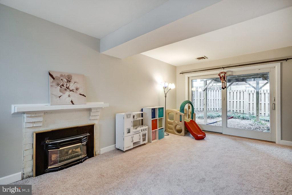 11041 Saffold Way Reston, VA 20190 - Photo 28 of 44 a living room with furniture and a fireplace