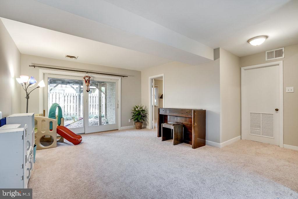 11041 Saffold Way Reston, VA 20190 - Photo 30 of 44 a view of a livingroom with furniture and a fireplace