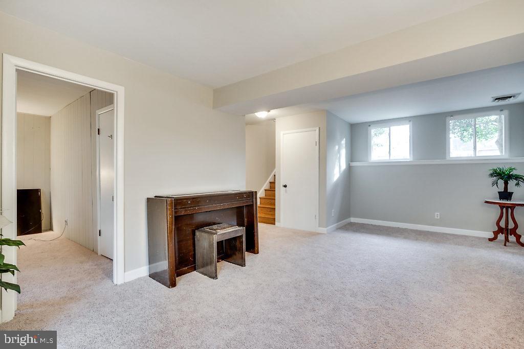 11041 Saffold Way Reston, VA 20190 - Photo 31 of 44 a view of an empty room with furniture and a window